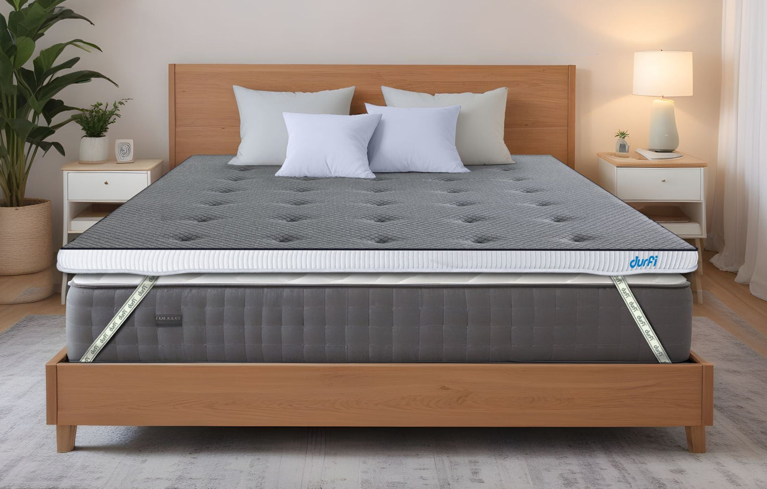 Durfi Soft Mattress Topper with grey tufted quilted surface placed over a mattress on a natural wood bed frame in a bright Scandinavian-style bedroom with indoor plants and white nightstands